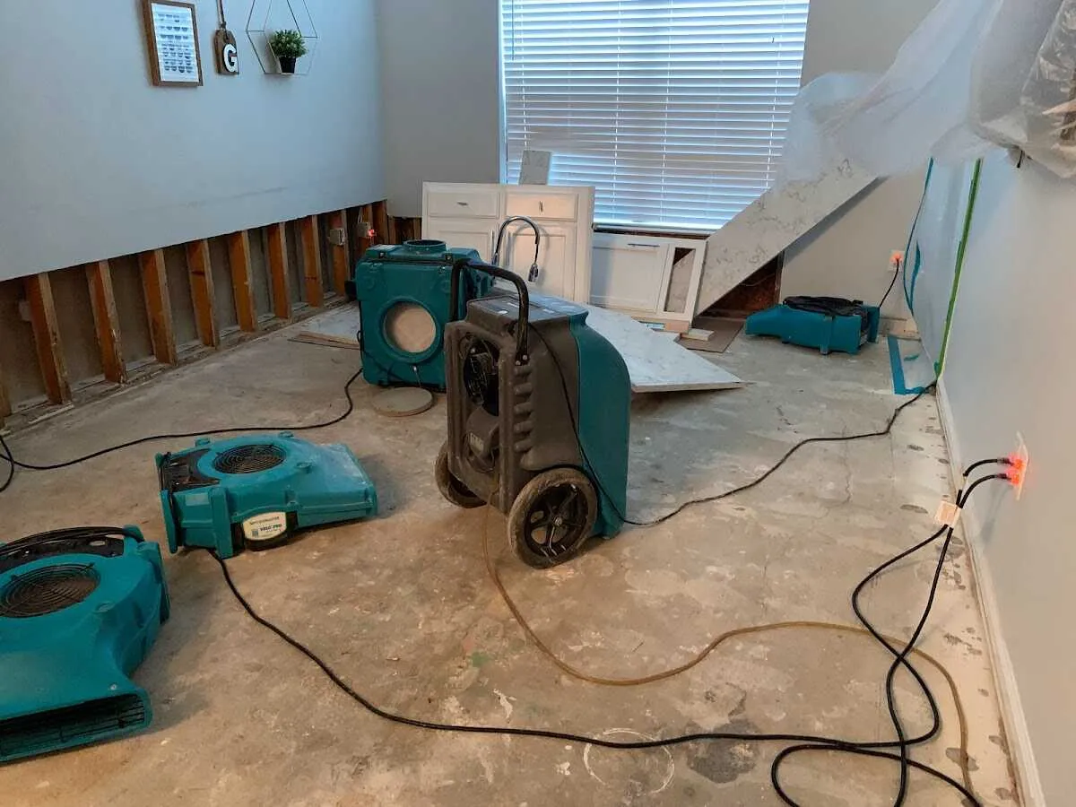 Dehumidifier in flood-cut room for Water Damage Restoration in Ojus